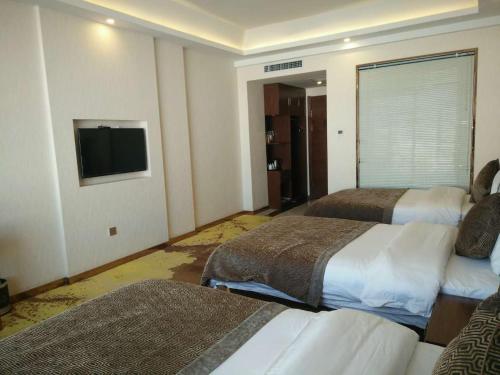 Imagen de la habitación del Hotel Dunhuang Dasheng Vacation. Foto 7