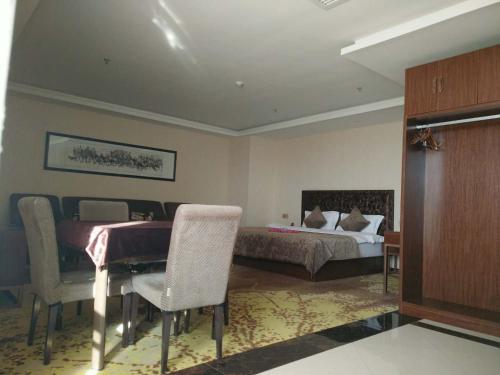 Imagen de la habitación del Hotel Dunhuang Dasheng Vacation. Foto 8