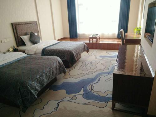 Imagen de la habitación del Hotel Dunhuang Dasheng Vacation. Foto 9