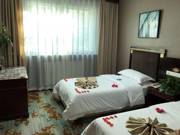 Imagen de la habitación del Hotel Dunhuang. Foto 12