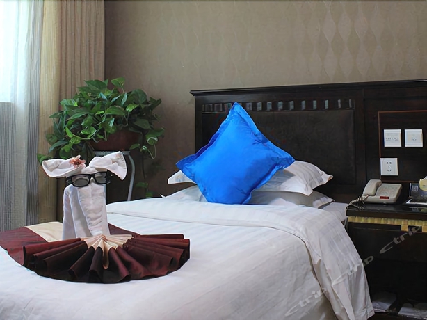 Imagen de la habitación del Hotel Dunhuang. Foto 16