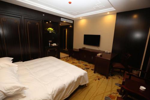 Imagen de la habitación del Hotel Dunhuang Hua Xia International. Foto 6