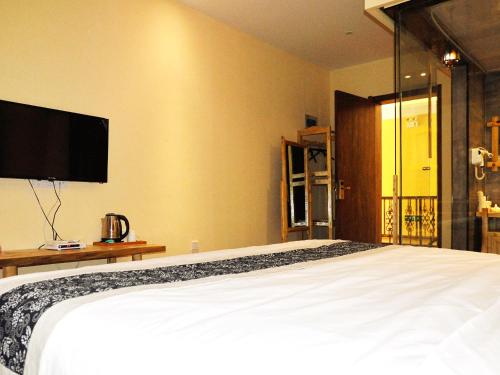 Imagen de la habitación del Hotel Dunhuang Jinshe Times Yododo Inn. Foto 8