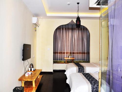 Imagen de la habitación del Hotel Dunhuang Jinshe Times Yododo Inn. Foto 9