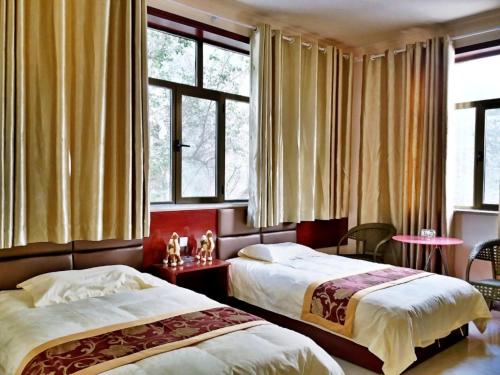 Imagen de la habitación del Hotel Dunhuang Mingshan Masion. Foto 7