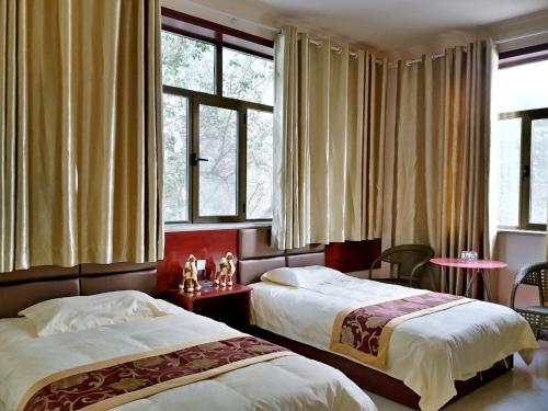 Imagen de la habitación del Hotel Dunhuang Mingshan Masion. Foto 9