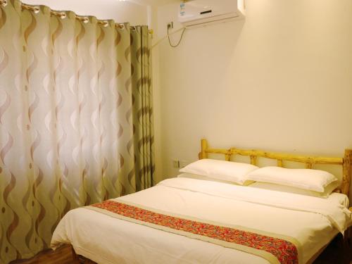 Imagen de la habitación del Hotel Dunhuang Silk Yododo Inn. Foto 9