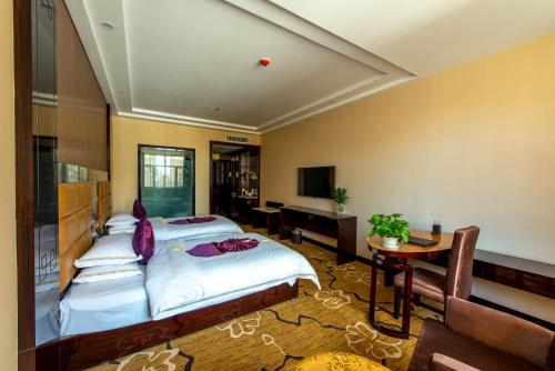 Imagen de la habitación del Hotel Dunhuang Suyuan. Foto 4