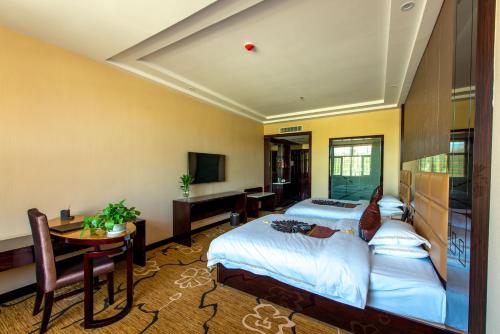 Imagen de la habitación del Hotel Dunhuang Suyuan. Foto 5