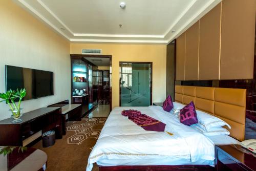 Imagen de la habitación del Hotel Dunhuang Suyuan. Foto 8