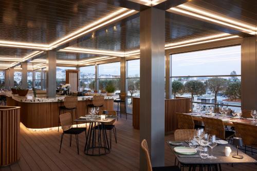 Imagen del bar/restaurante del Hotel Dusit Suites Athens, Glyfada. Foto 8