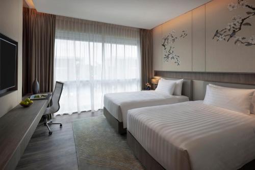 Imagen de la habitación del Hotel Dusit Thani Laguna Singapore. Foto 8