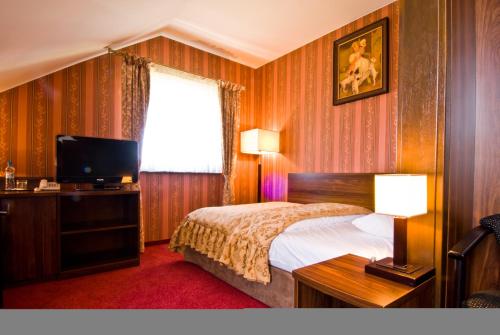Imagen de la habitación del Hotel Dworski Galaktyczny Park. Foto 9