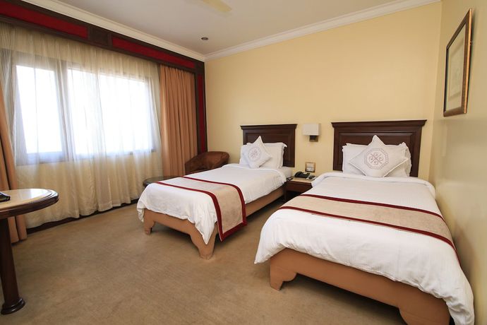 Imagen de la habitación del Hotel Dynasty, Guwahati. Foto 2