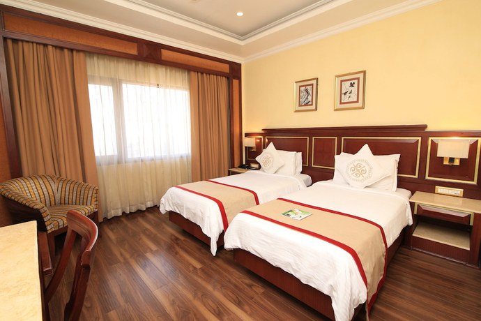 Imagen de la habitación del Hotel Dynasty, Guwahati. Foto 5