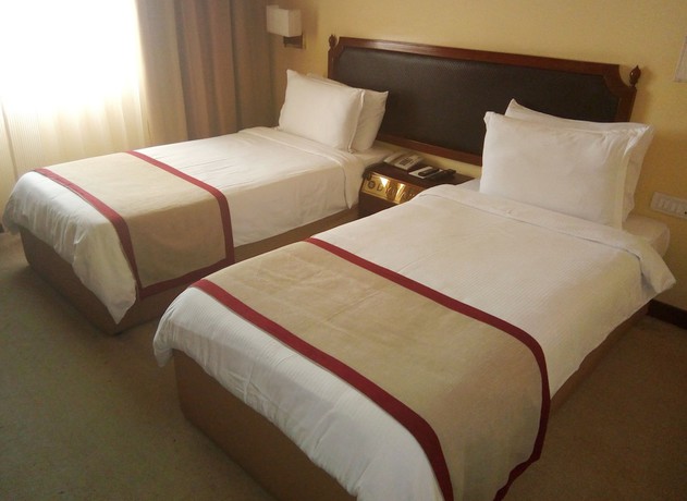 Imagen de la habitación del Hotel Dynasty, Guwahati. Foto 17
