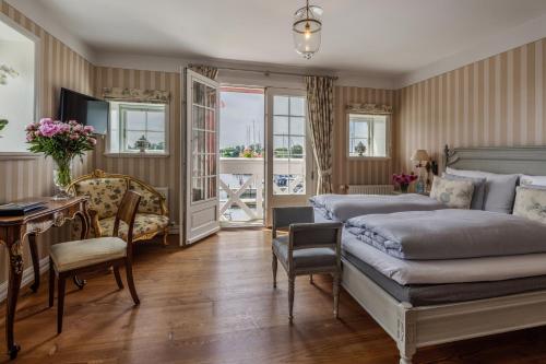 Imagen de la habitación del Hotel Dyvig Badehotel. Foto 13