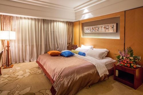 Imagen de la habitación del Hotel E Mei Shan Central Sunshine. Foto 7