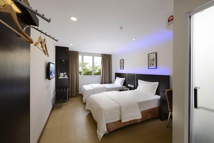Imagen de la habitación del Hotel E-Red Bayu Mutiara. Foto 12