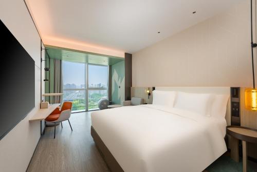 Imagen de la habitación del Hotel EVEN Qingdao Laoshan - an IHG. Foto 12
