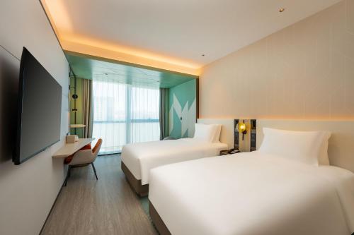 Imagen de la habitación del Hotel EVEN Qingdao Laoshan - an IHG. Foto 14