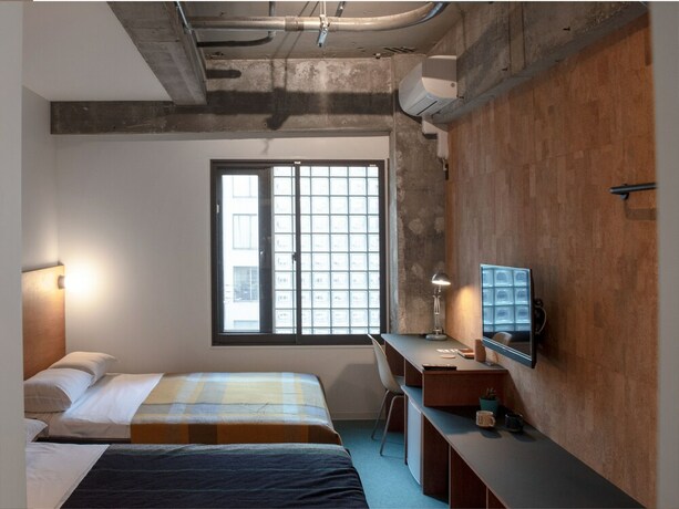 Imagen de la habitación del Hotel Earthmans Amemura. Foto 27