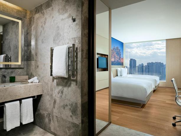 Imagen de la habitación del Hotel East Beijing. Foto 13