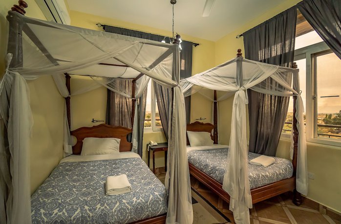 Imagen de la habitación del Hotel East Point Moshi. Foto 18