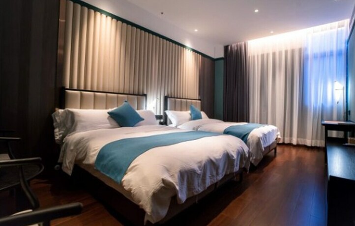 Imagen de la habitación del Hotel East Sea Chaozhou. Foto 11