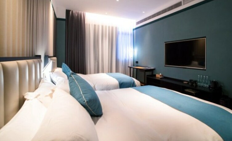 Imagen de la habitación del Hotel East Sea Chaozhou. Foto 15