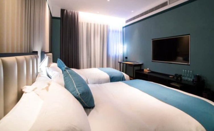 Imagen de la habitación del Hotel East Sea Chaozhou. Foto 18