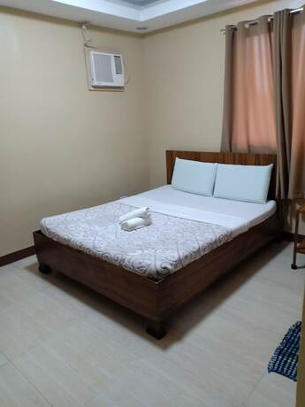 Imagen de la habitación del Hotel East Square Inn. Foto 9