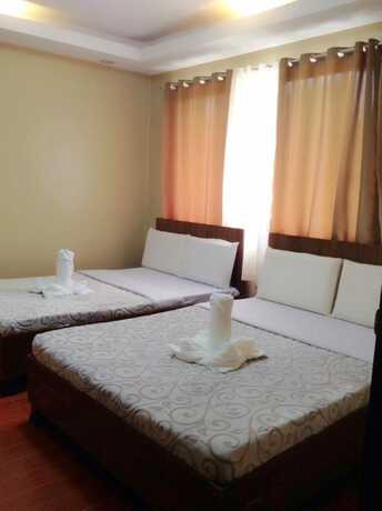 Imagen de la habitación del Hotel East Square Inn. Foto 10
