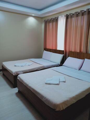 Imagen de la habitación del Hotel East Square Inn. Foto 11