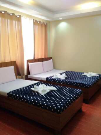 Imagen de la habitación del Hotel East Square Inn. Foto 13
