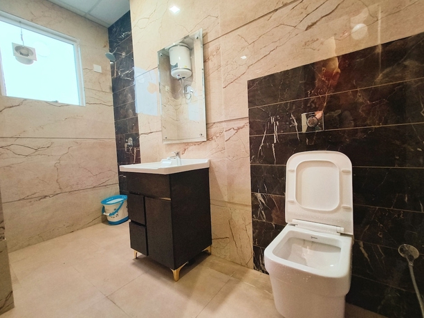 Imagen de la habitación del Hotel East Wood Amritsar. Foto 16