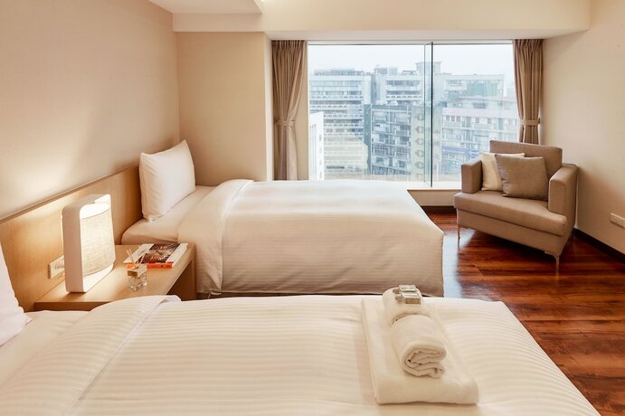 Imagen de la habitación del Hotel Eastin Taipei. Foto 11