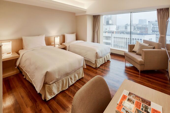 Imagen de la habitación del Hotel Eastin Taipei. Foto 13