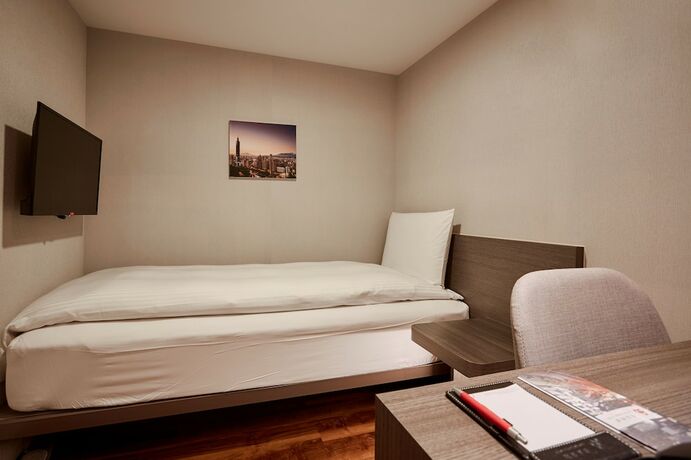 Imagen de la habitación del Hotel Eastin Taipei. Foto 17