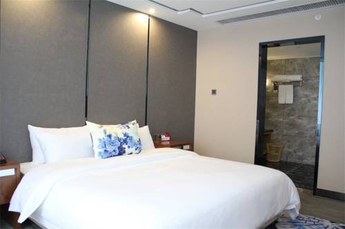 Imagen de la habitación del Hotel Eastone Vegetarian Culture. Foto 1
