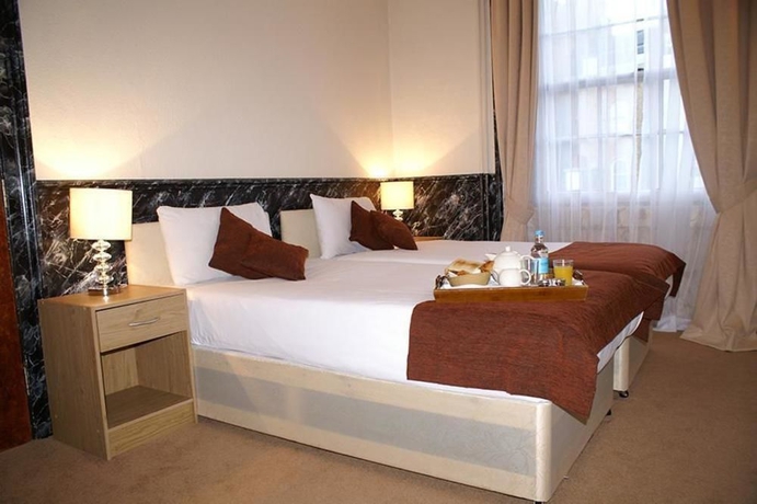 Imagen de la habitación del Hotel Eaton Square. Foto 13