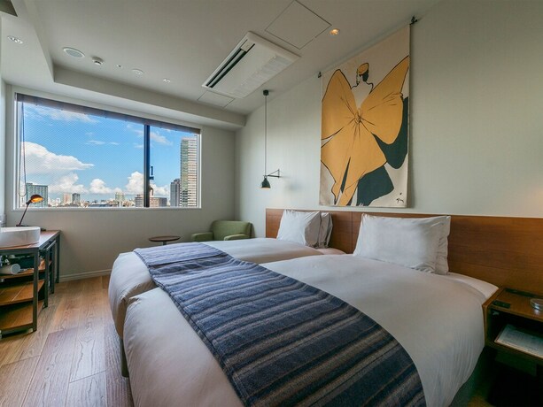 Imagen de la habitación del Hotel Ebisuholic. Foto 19