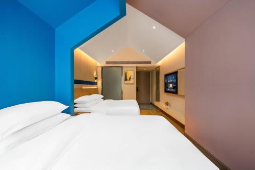 Imagen general del Hotel Echarm Chongqing Kaizhou Sports Square Branch. Foto 5