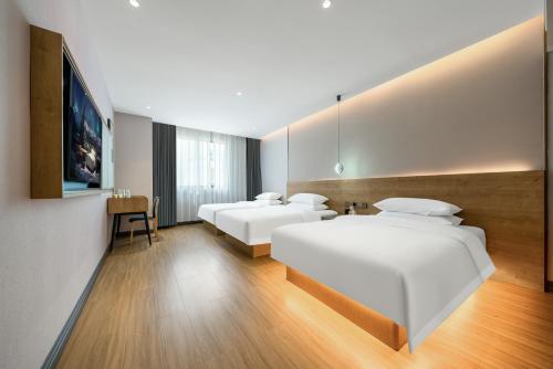 Imagen general del Hotel Echarm Chongqing Kaizhou Sports Square Branch. Foto 7