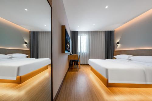 Imagen general del Hotel Echarm Chongqing Kaizhou Sports Square Branch. Foto 12