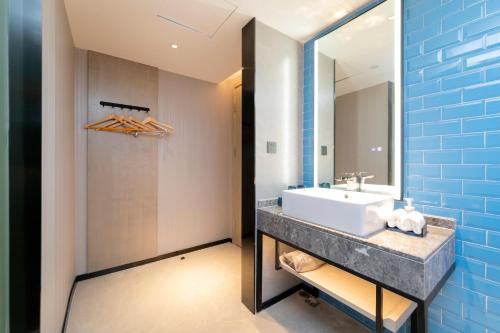 Imagen de la habitación del Hotel Echarm Guanggu Tiandi. Foto 11