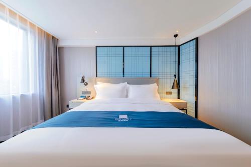 Imagen de la habitación del Hotel Echarm Guanggu Tiandi. Foto 12