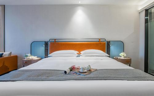 Imagen de la habitación del Hotel Echarm Guangzhou Jiahe Helong Branch. Foto 16