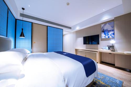 Imagen de la habitación del Hotel Echarm Guigang Wanda High Speed Railway Station. Foto 19