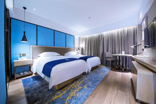 Imagen de la habitación del Hotel Echarm Guigang Wanda High Speed Railway Station. Foto 20